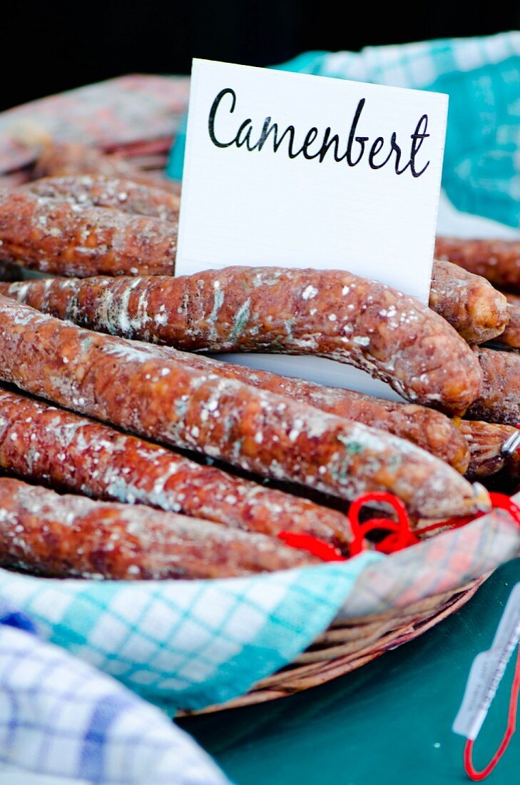 French Camembert sausage at a market