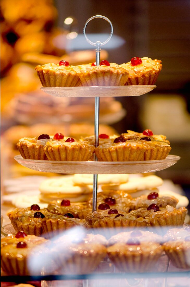 Cherry frangipane cakes in the window of a bakery