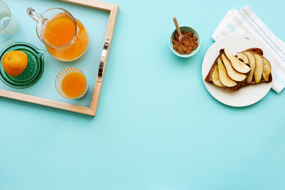Breakfast with orange juice and pears on toast