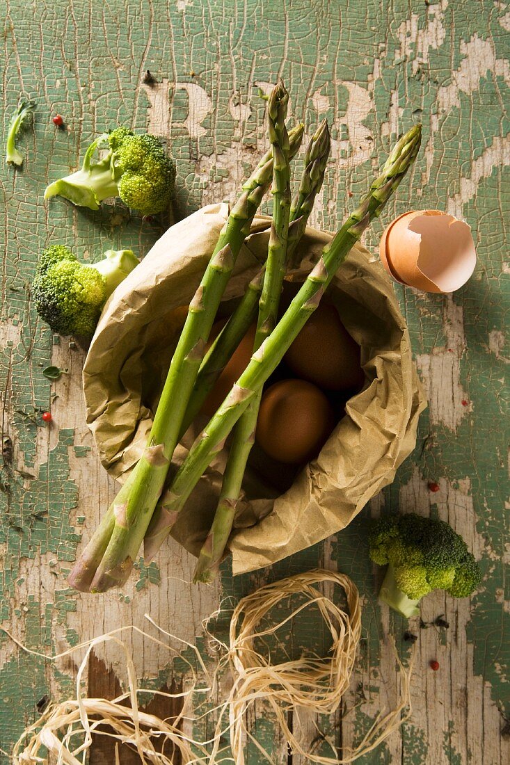 An arrangement of eggs and green vegetables