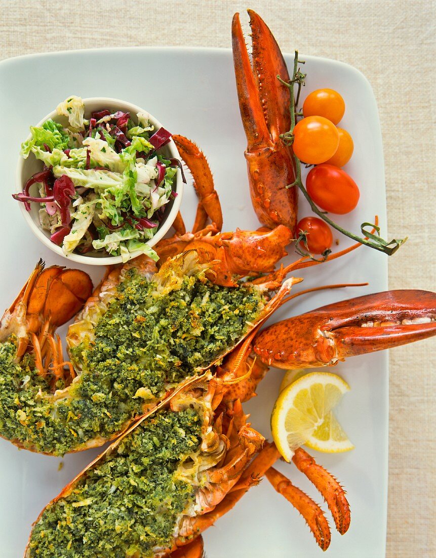 Lobster with a herb filling and salad