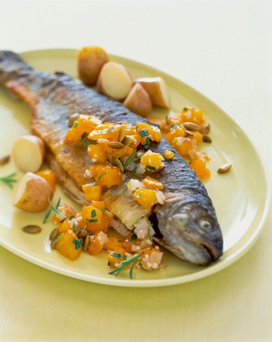 Fried trout with a pumpkin medley and potatoes