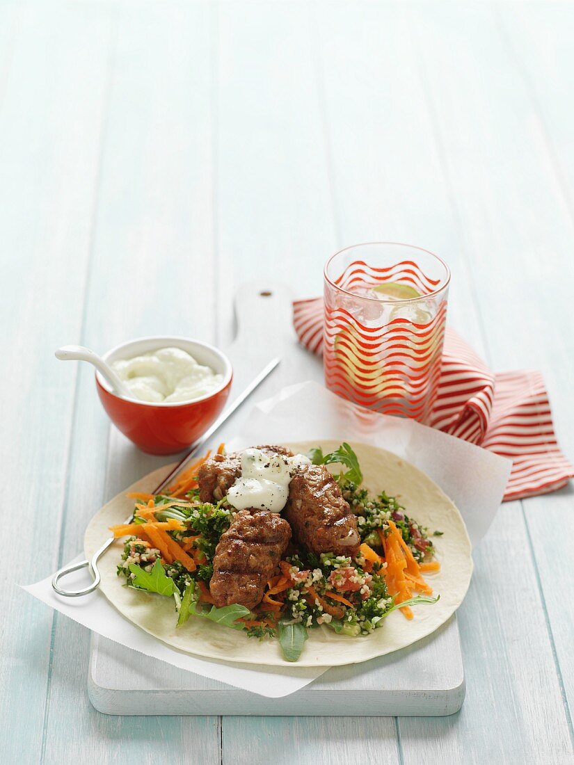 Lamb kofta on a bed of tabbouleh