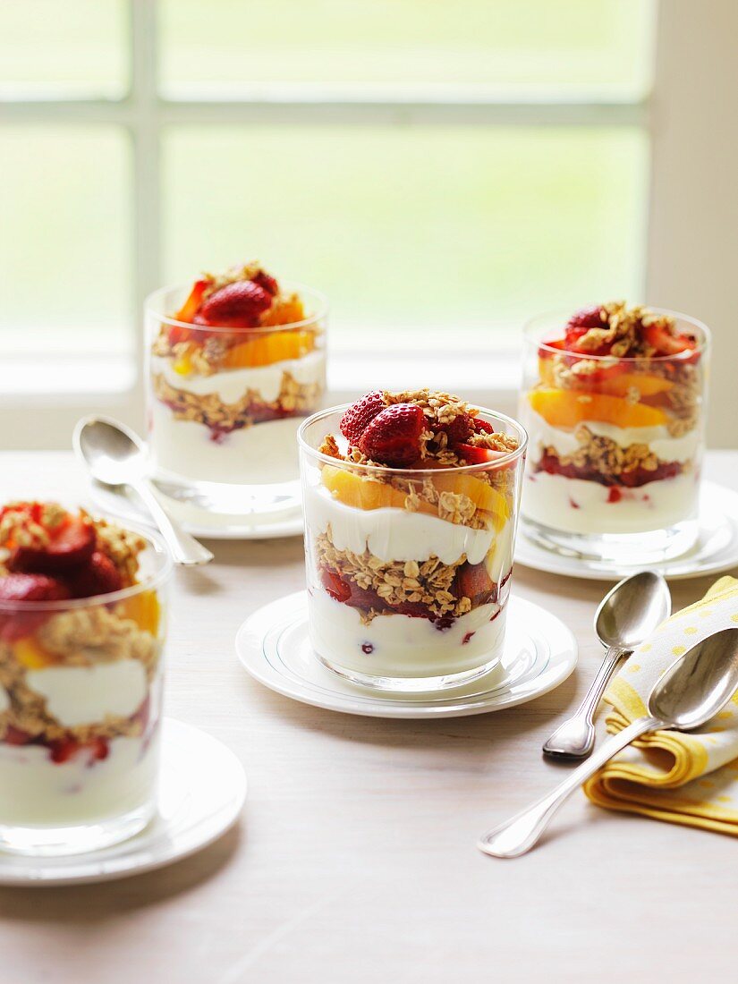 Layered desserts with parfait, fruit and muesli