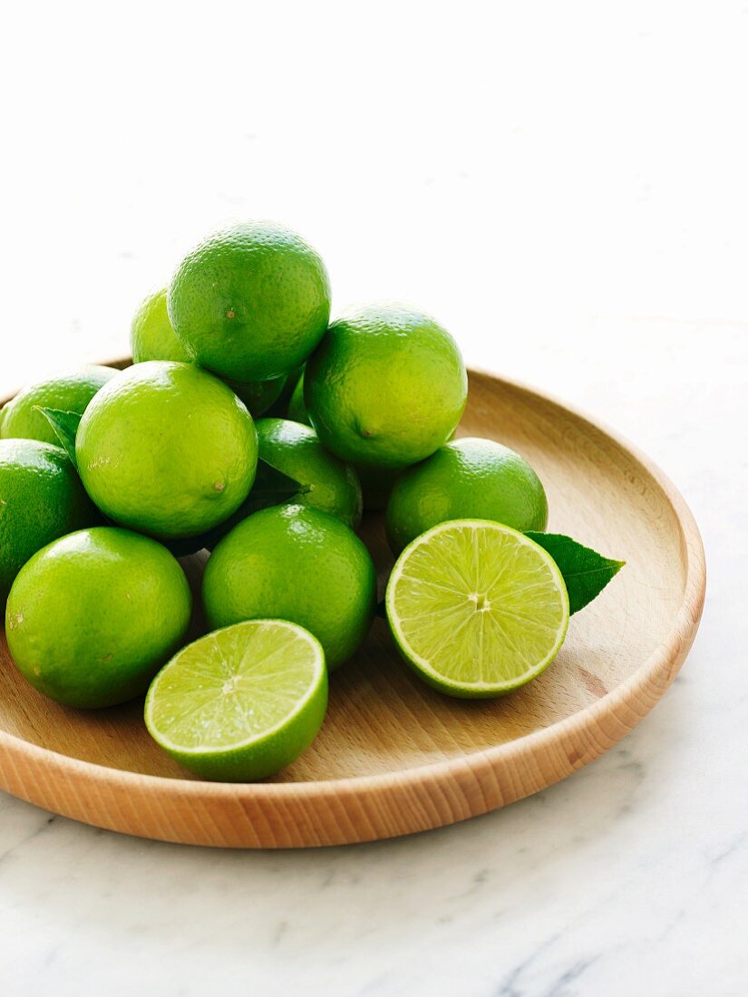 Limes on a wooden plate