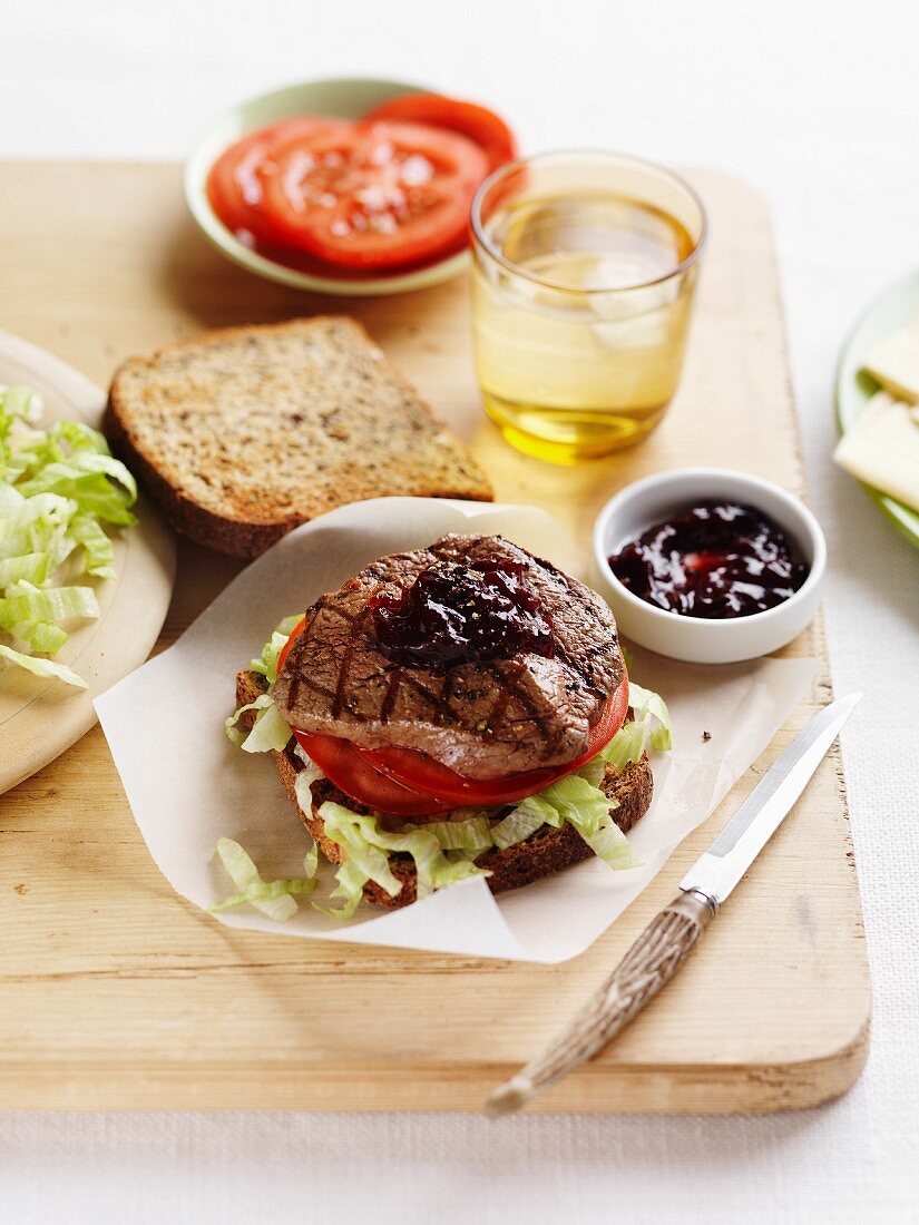 A minute steak, tomato and salad sandwich