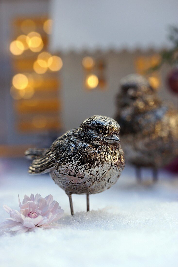 Bird ornament on artificial snow