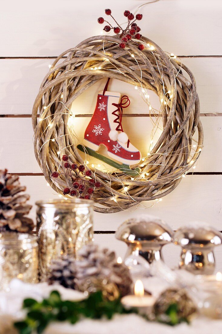 Wicker wreath with fairy lights and ice skate bauble