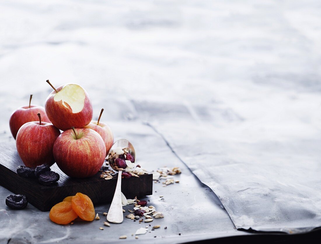 An arrangement of apples, dried fruits and muesli