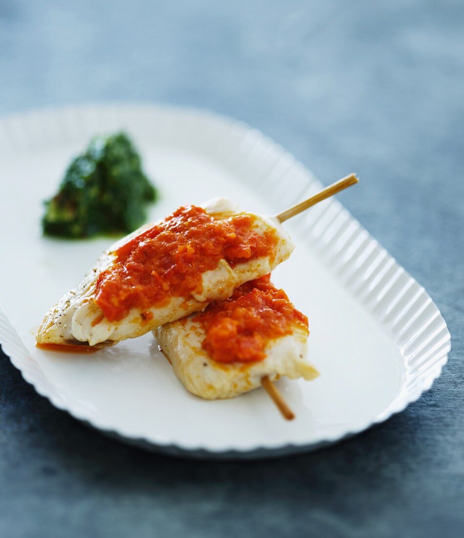 Chicken skewers with tomato sauce