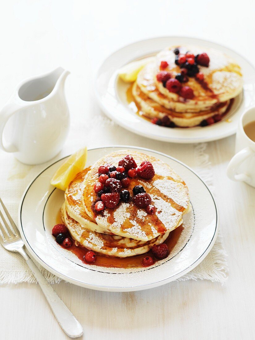 Vanilla pancakes with berries and maple syrup