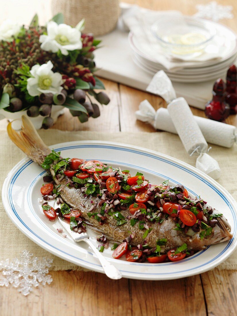 Red snapper with olive and tomato salsa