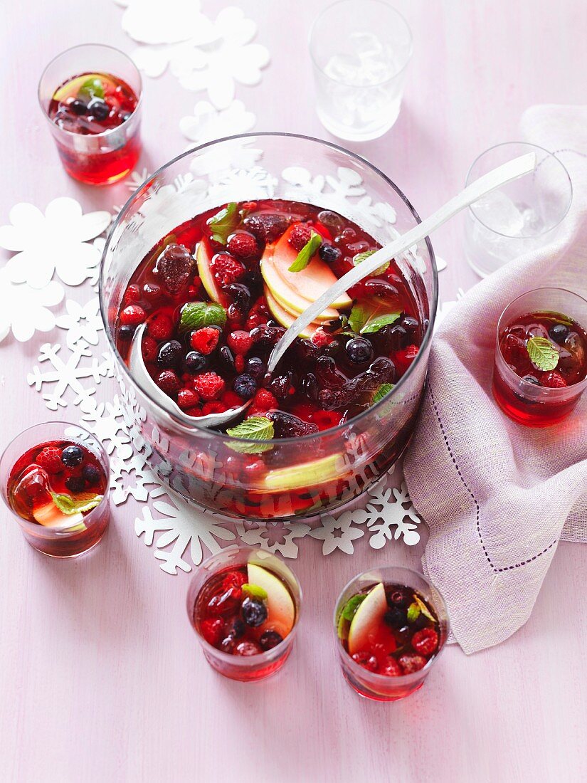Apple punch with raspberries, blueberries and cranberries