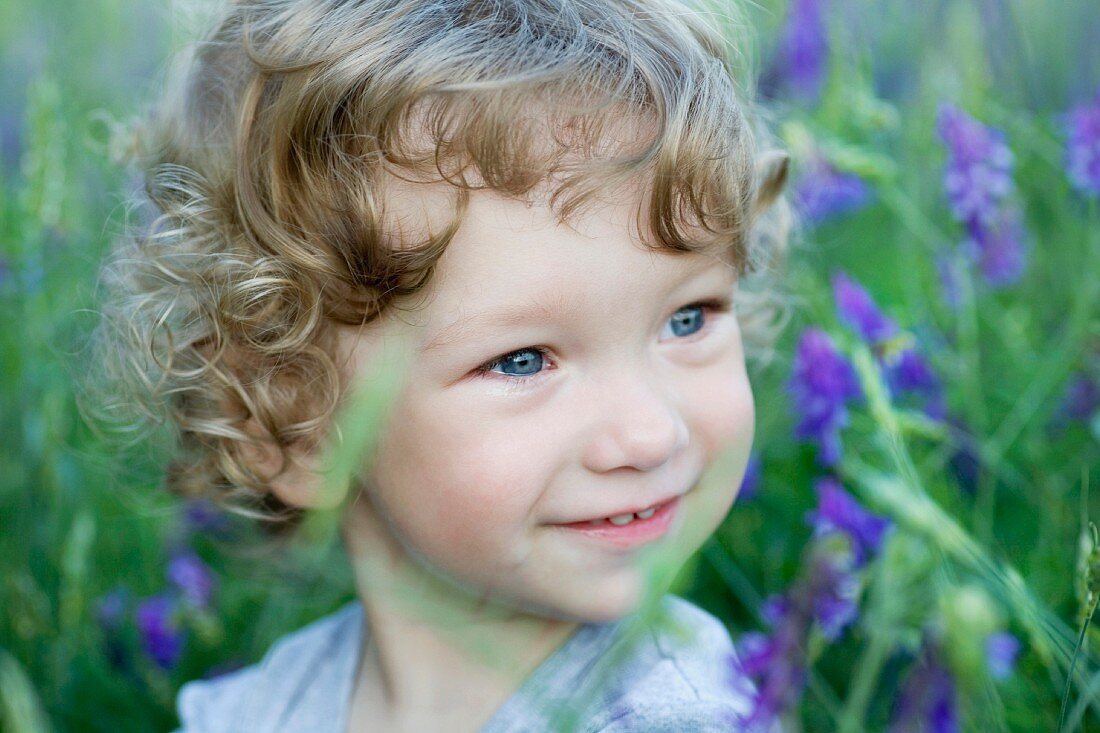 Portrait of a young boy looking away smiling