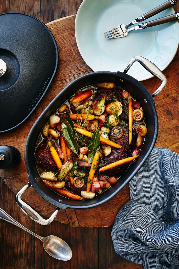 Coq au vin in a braising dish