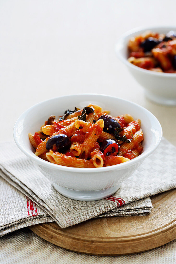 Penne Puttanesca with tomatoes, anchovies and olives