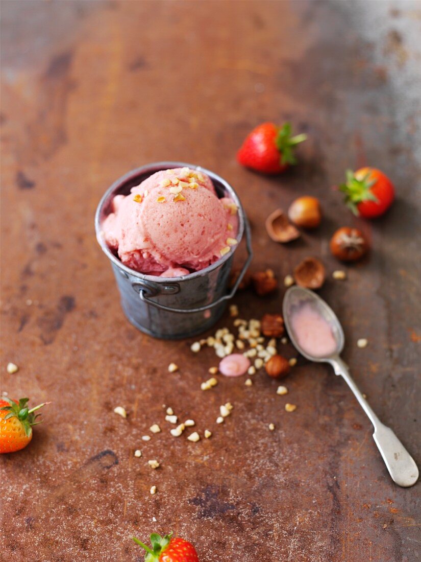 Strawberry ice cream with chopped hazelnuts