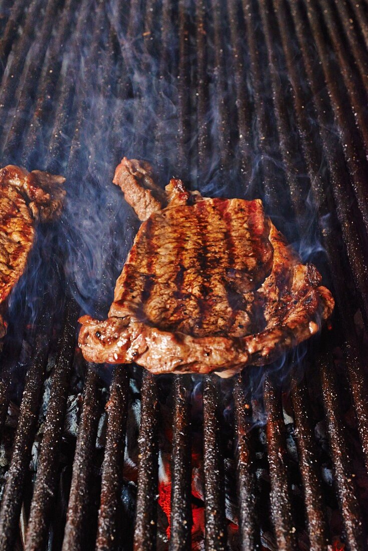 A beef steak on a grill