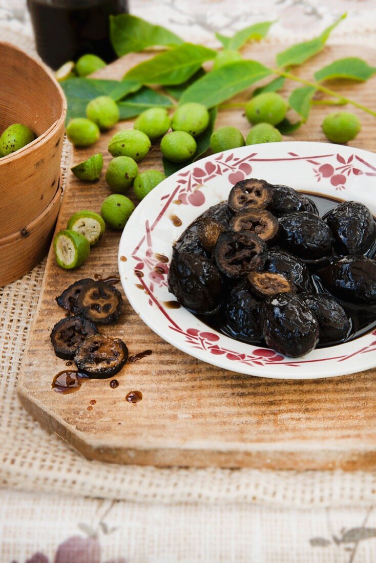 Black nuts in sugar syrup