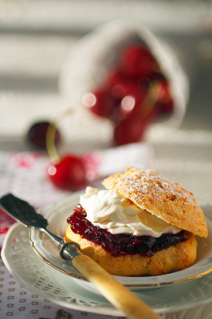 A scone filled with cherry jam and cream cheese