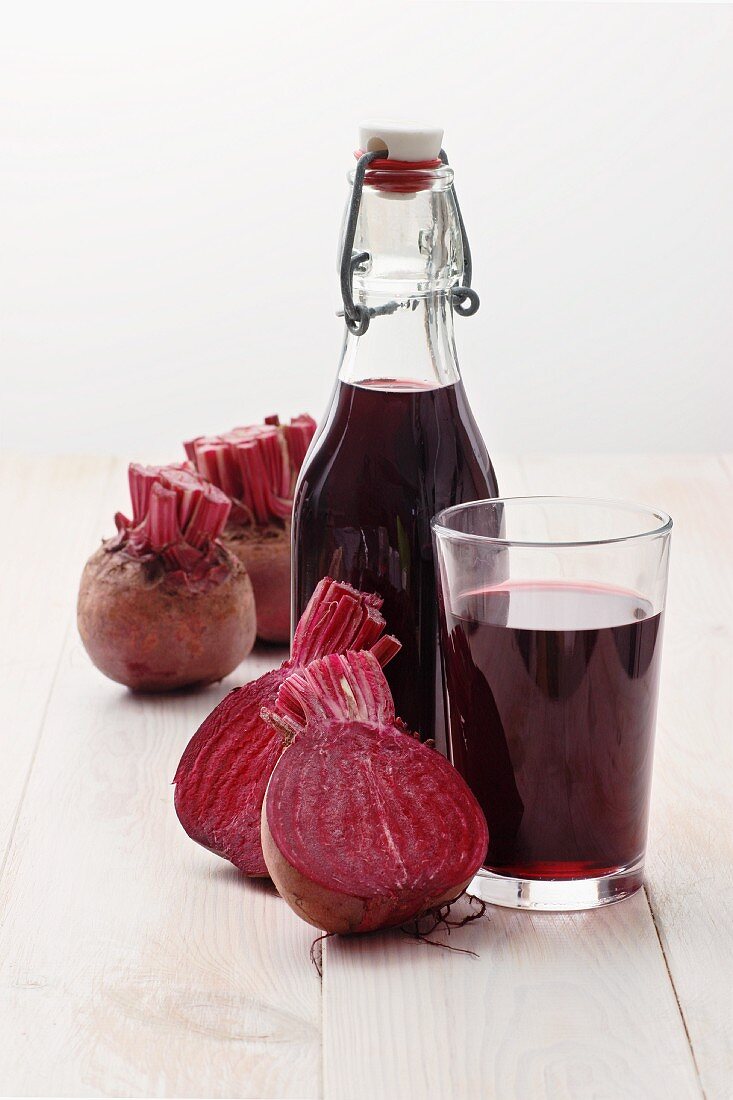 A bottle and a glass of beetroot juice