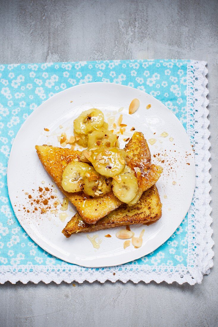 French toast with caramelised bananas and slivered almonds