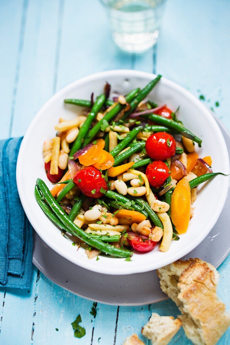 Fried vegetables with beans, carrots and tomatoes