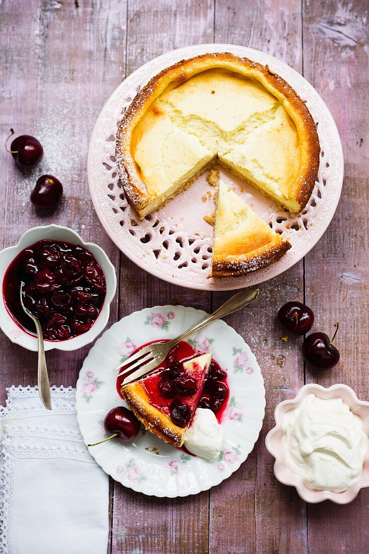 Cheesecake with cherries and cream