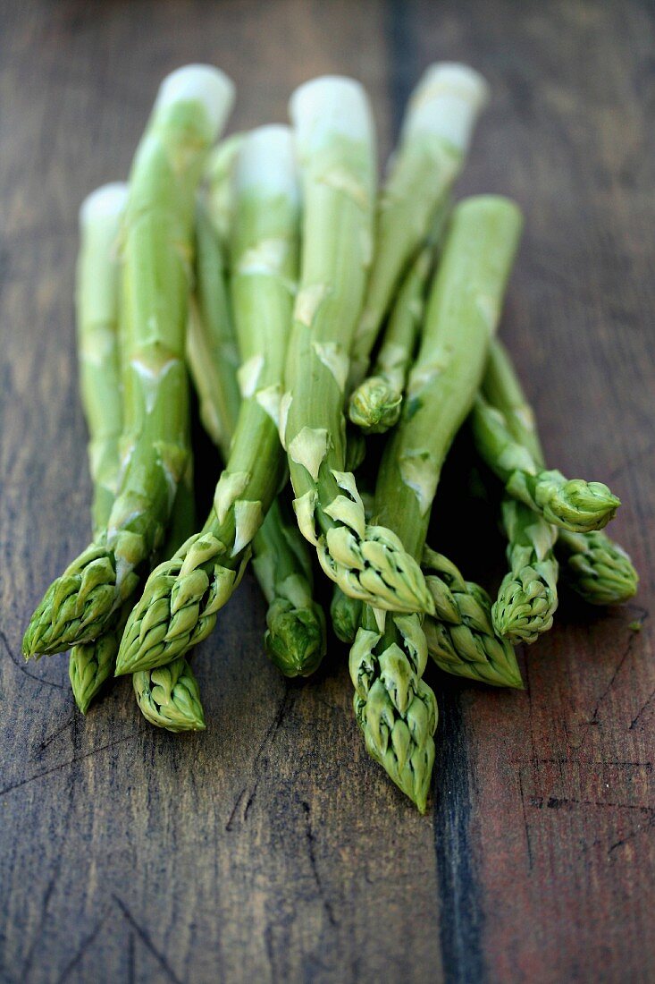 Green asparagus on a wooden table