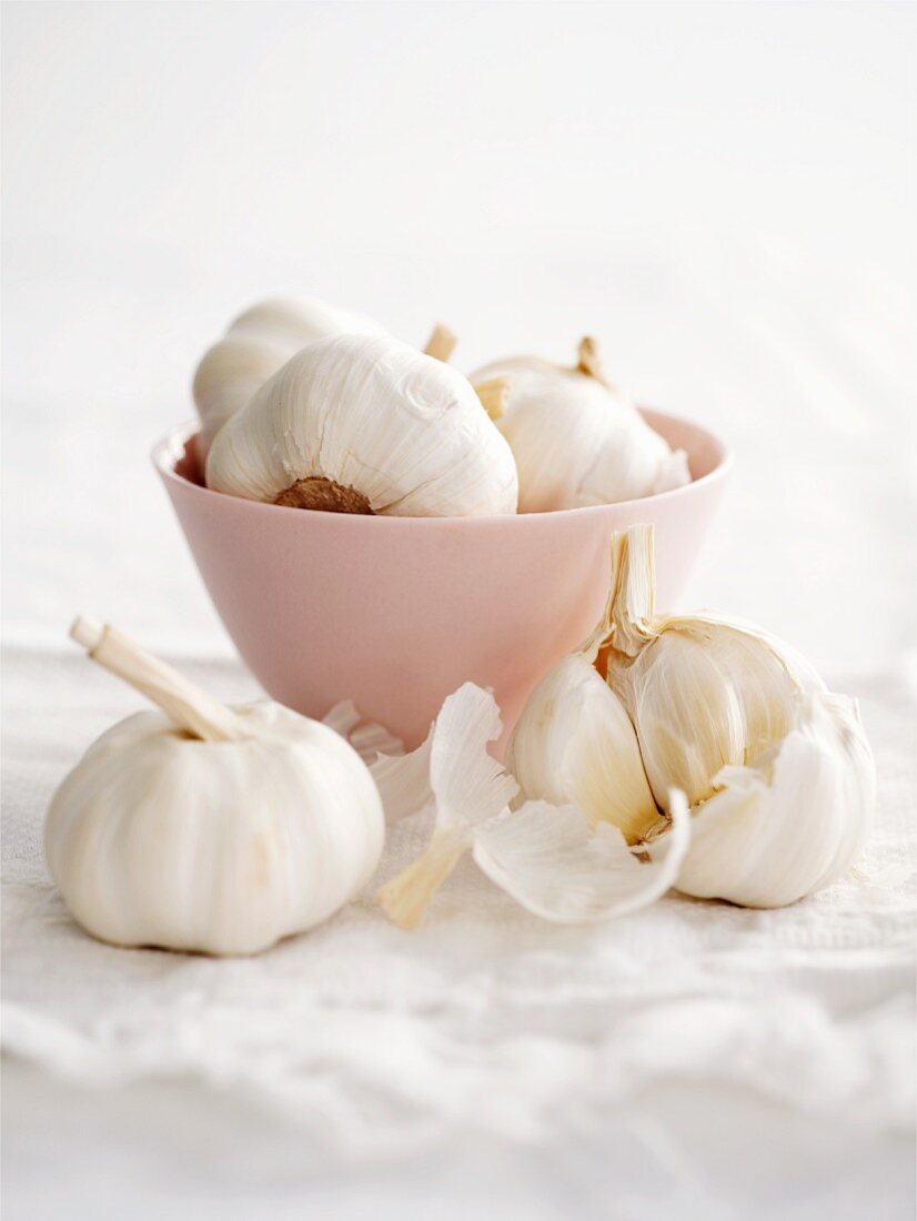 A bowl of garlic bulbs