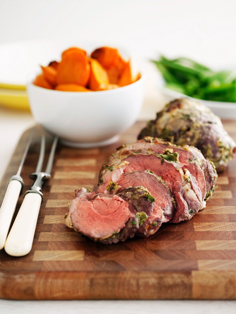 Leg of lamb with a herb crust and oven-roasted vegetables