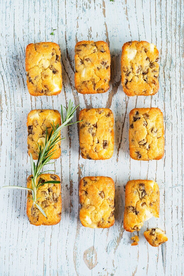 Mini aubergine cakes with feta, one with a bite taken out