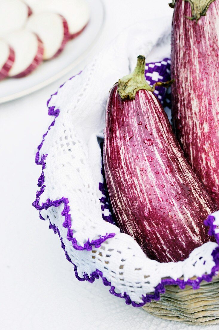 Two aubergines in a basket