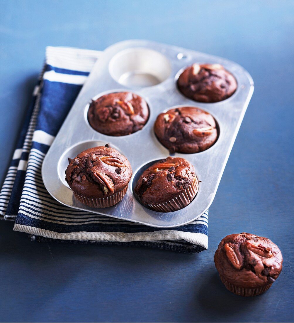 Pecan nut muffins in a muffin tin