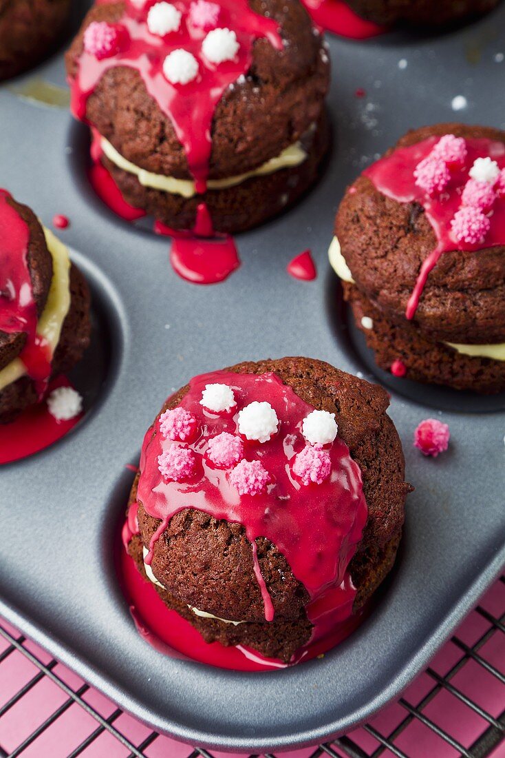Red velvet whoopie pies decorated with sugar balls