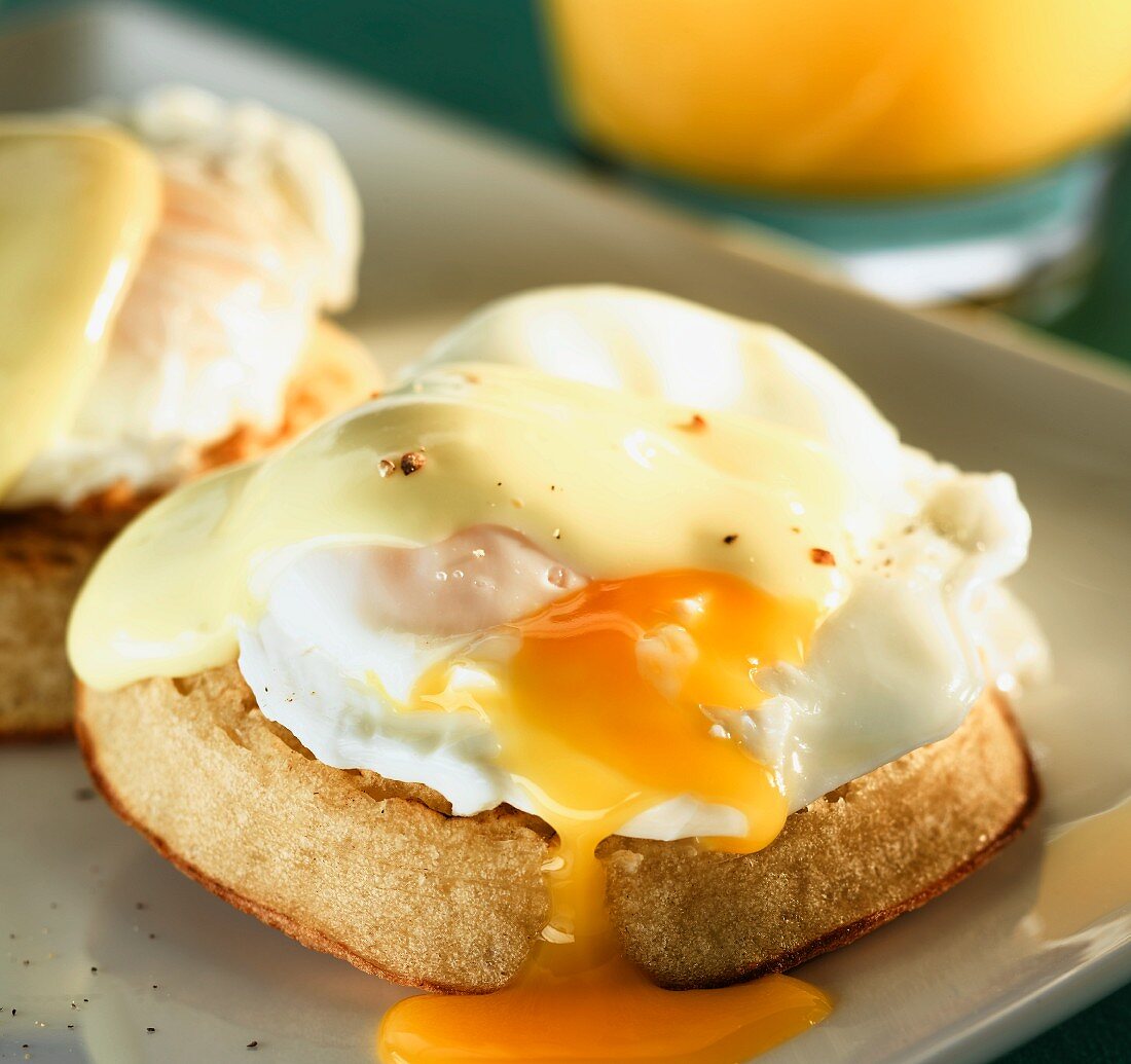 A poached egg with Hollandaise sauce on a muffin