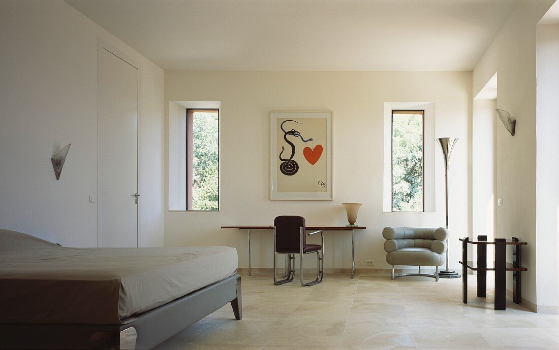 Minimalist bedroom with chair and armchair in Bauhaus style