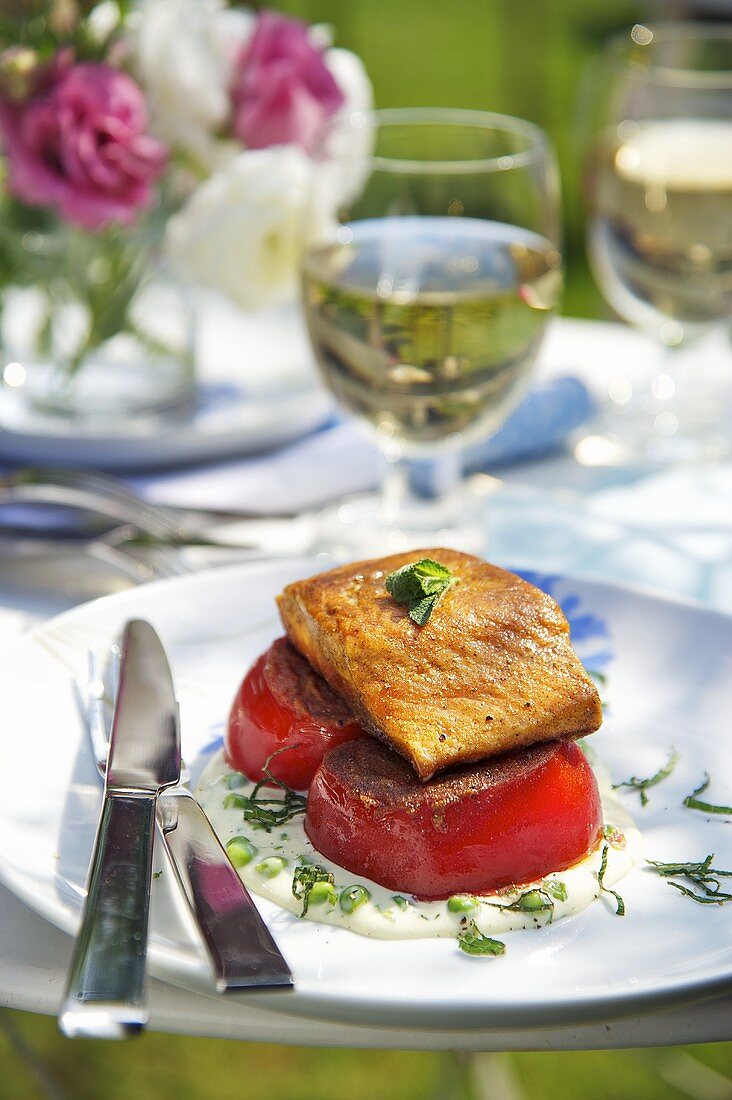 Salmon fillet on a bed of curried tomatoes