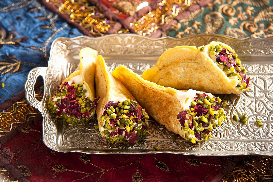 Quataif with pistachios (filled crepes, Arabia)