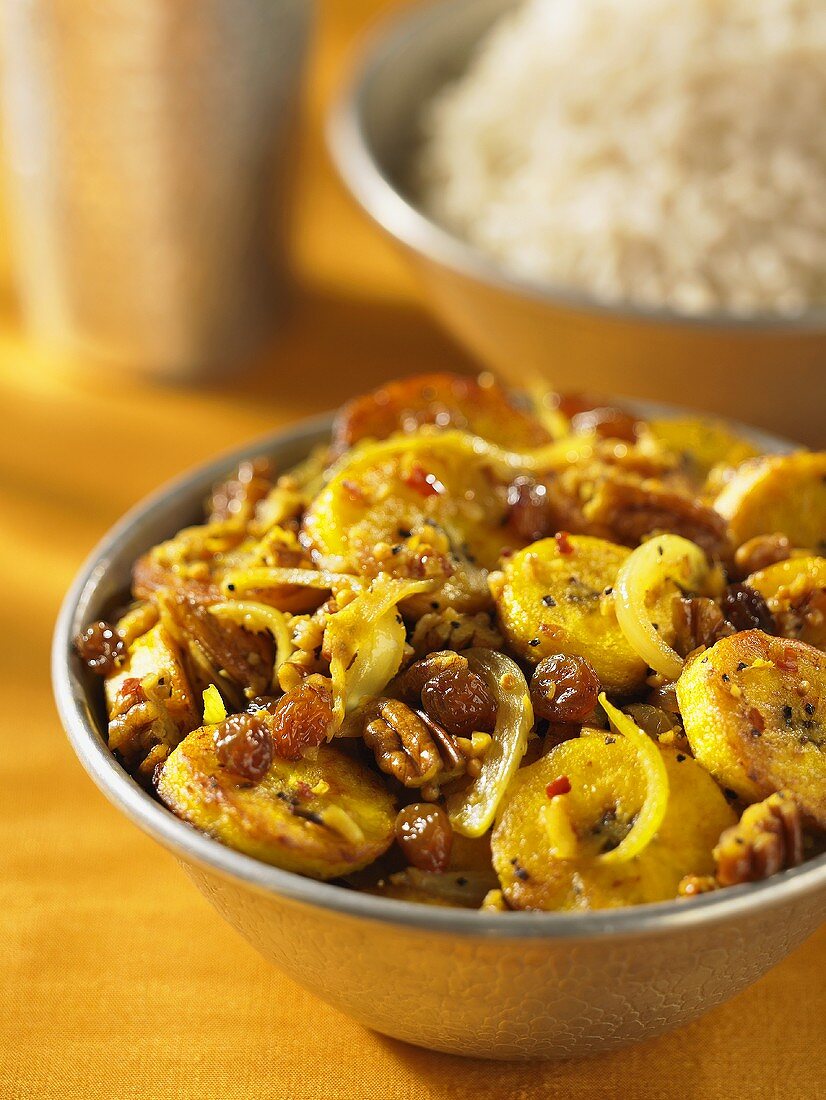 Plantain curry with raisins and pecan nuts