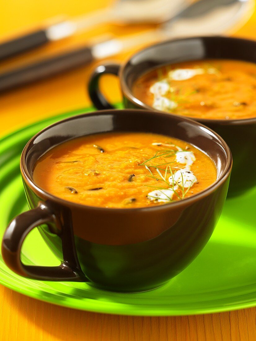 Cups of tomato soup with wild rice