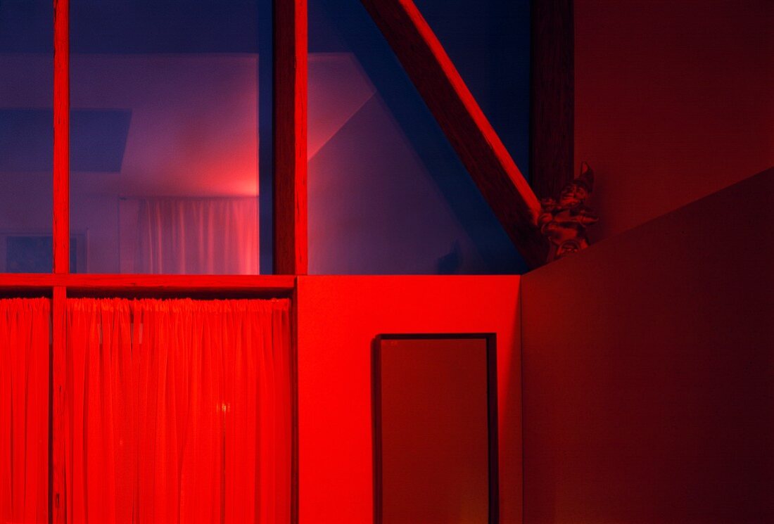 Corner of room bathed in red light