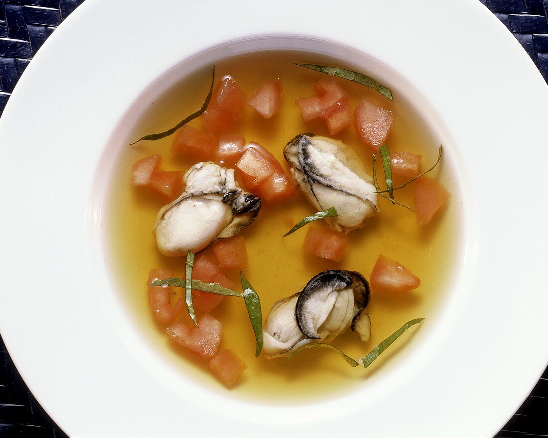 Fish Soup with Oysters and diced Tomato