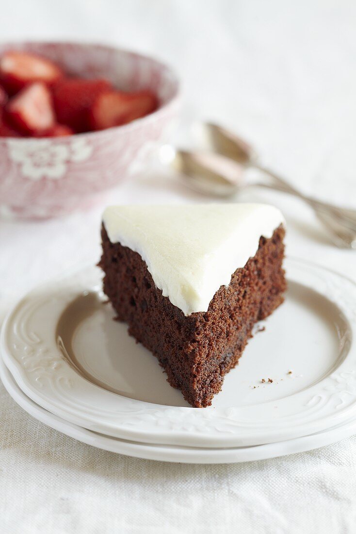A piece of chocolate cake with cream