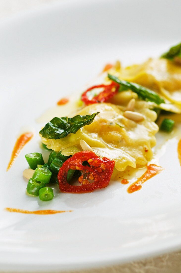 Cream cheese ravioli with pine butter and vegetables