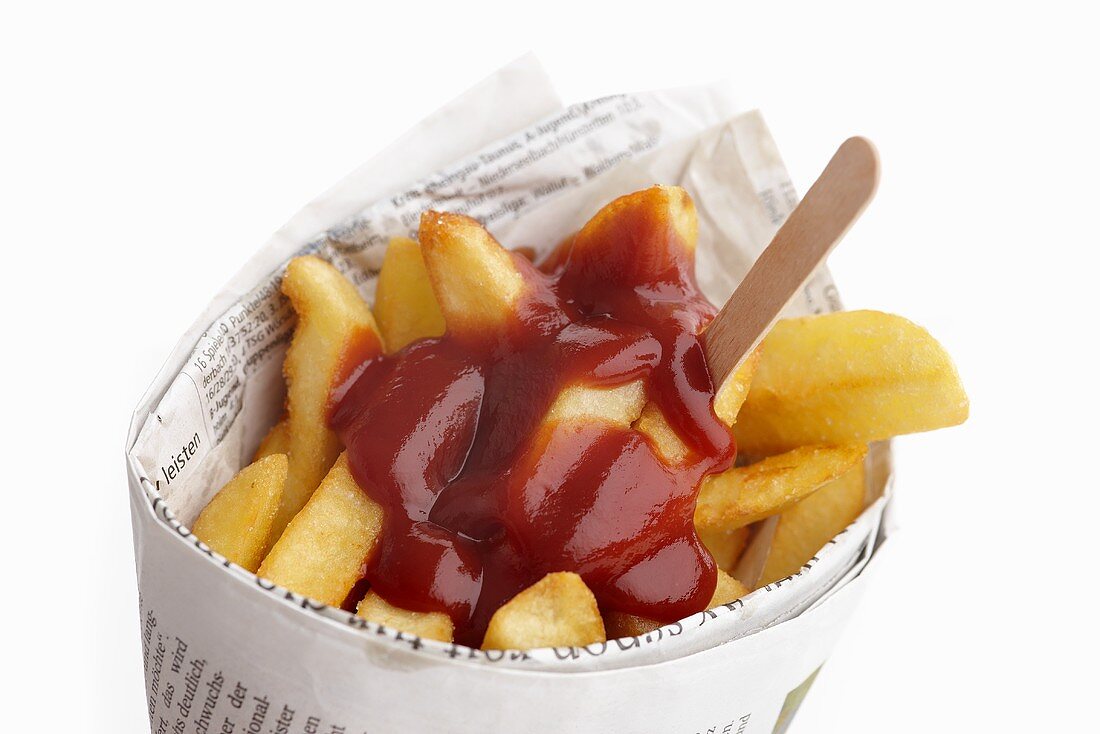 Chips and ketchup wrapped in newspaper