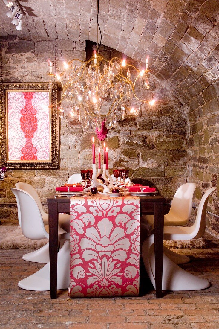 A festively laid table for Christmas dinner in a vaulted cellar