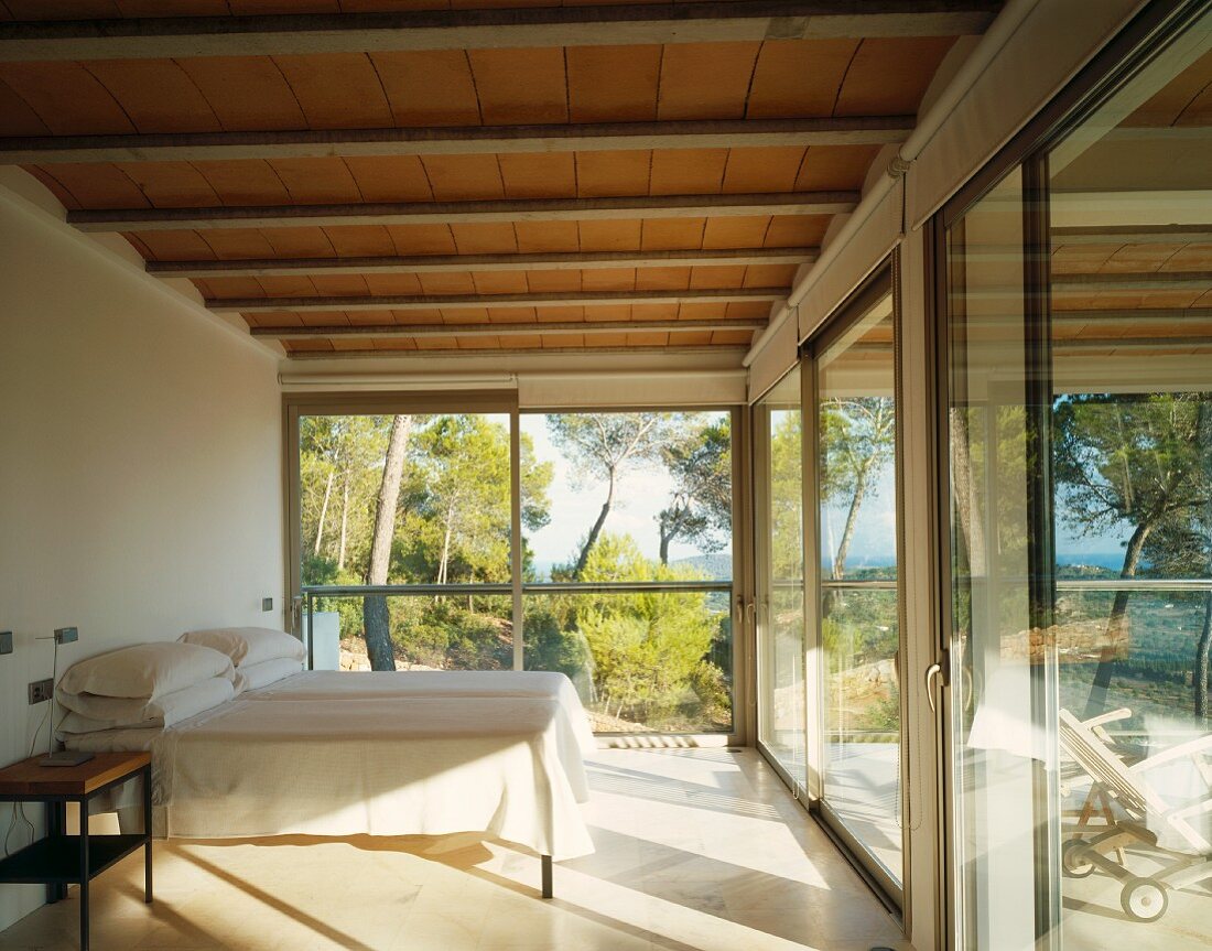 Minimalist bedroom with panoramic window