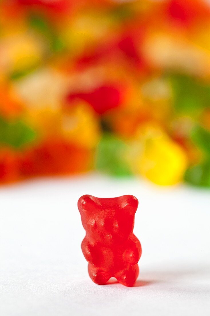Red Gummie Bear; Many Gummie Bears in Background