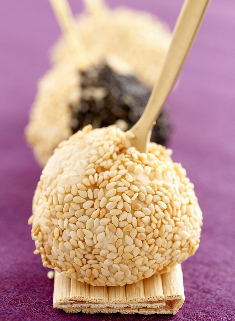 Halva balls with sesame seeds